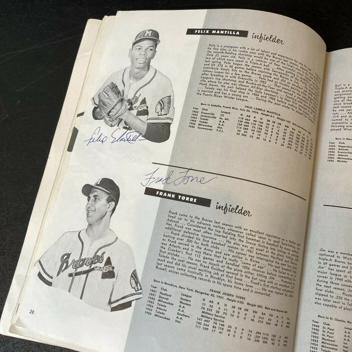 1957 Milwaukee Braves W.S. Champs Team Signed Yearbook Hank Aaron JSA COA